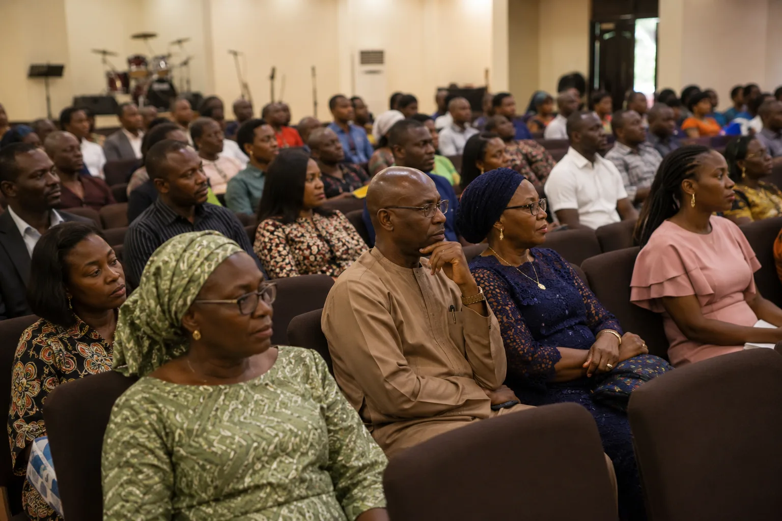 GECCI congregation listening during a service